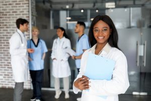 Beautiful young black woman doctor attending medical conference